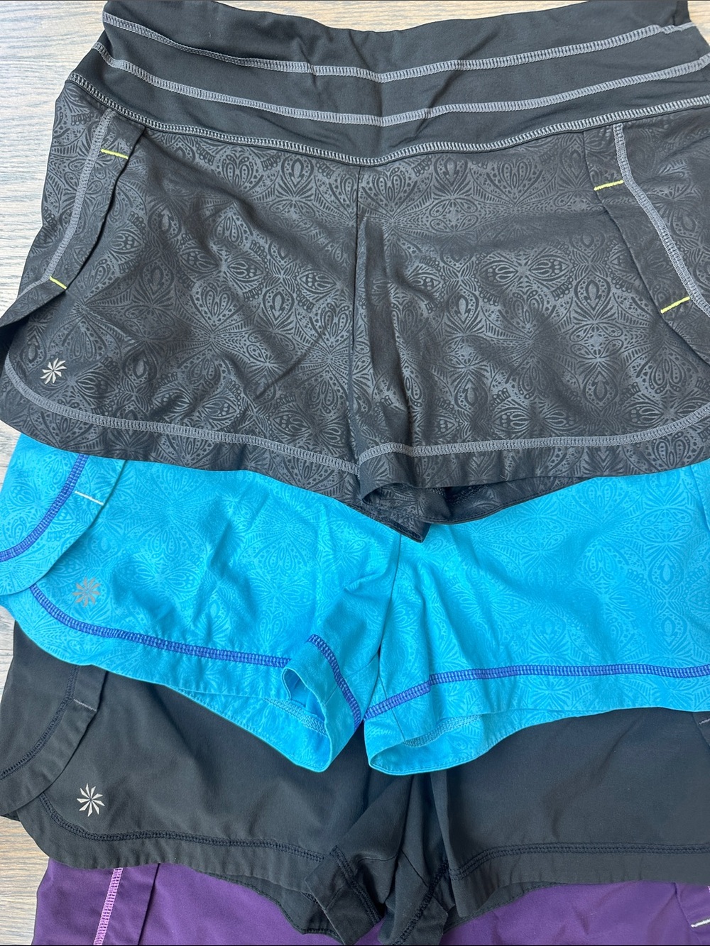 Athleta Women’s Athletic Shorts — Black, Turquoise, Purple - 4 Pairs - Picture 3 of 4